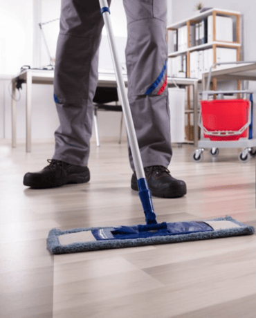 Worker Mopping Office Floor