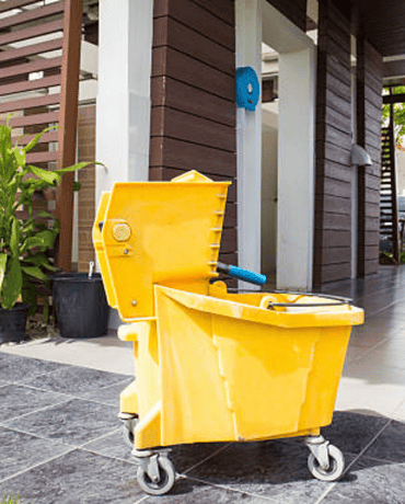 Yellow cleaning bucket with wheels